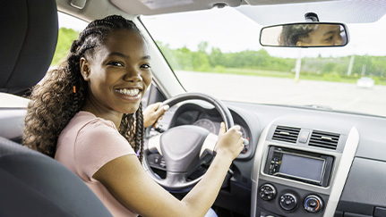 Teen in white car